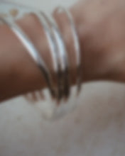 Load and play video in Gallery viewer, RECYCLED STERLING SILVER HAMMERED BANGLES - 4MM WIDTH