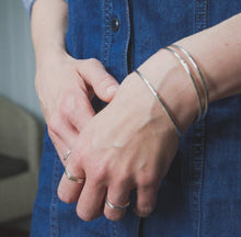 Load image into Gallery viewer, SET OF 2 RECYCLED SILVER SKINNY STACKING BANGLES
