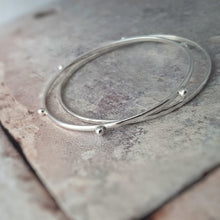 Load image into Gallery viewer, RECYCLED SILVER SKINNY STACKING BANGLES
