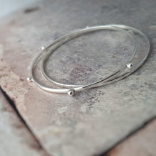 Load image into Gallery viewer, SET OF 2 RECYCLED SILVER SKINNY STACKING BANGLES
